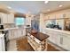 Well-lit kitchen with stainless steel appliances, center island, and white cabinets at 5033 Baylor Dr, Charlotte, NC 28210