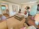 Bright and open living room with neutral decor, a fireplace, and hardwood floors at 5033 Baylor Dr, Charlotte, NC 28210