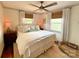 Comfortable bedroom with hardwood floors, multiple windows, and neutral decor at 5033 Baylor Dr, Charlotte, NC 28210