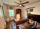 Home office featuring a ceiling fan, a window, and a writing desk at 5033 Baylor Dr, Charlotte, NC 28210