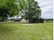 View of horse paddock and storage in this large back yard at 5628 White Store Rd, Wingate, NC 28174
