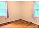 Bedroom featuring hardwood floors, neutral walls, and windows providing plenty of natural light and outdoor views at 5628 White Store Rd, Wingate, NC 28174