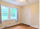 Bedroom featuring hardwood floors, neutral walls, and windows providing plenty of natural light and outdoor views at 5628 White Store Rd, Wingate, NC 28174