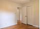 Bright bedroom features hardwood floors, closet, and neutral paint, creating a cozy and inviting atmosphere at 5628 White Store Rd, Wingate, NC 28174