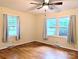 Bedroom featuring hardwood floors, neutral walls, and windows providing plenty of natural light and outdoor views at 5628 White Store Rd, Wingate, NC 28174