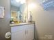 This bathroom has white cabinets, light gray countertops, and modern fixtures at 54 Woodsdale Se Pl, Concord, NC 28025