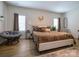 Cozy bedroom featuring a comfortable bed with plush pillows, natural light, and hardwood floors for a serene retreat at 54 Woodsdale Se Pl, Concord, NC 28025