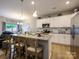 Spacious kitchen with stainless steel appliances, an island with seating, and open layout at 54 Woodsdale Se Pl, Concord, NC 28025