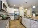 Well-equipped kitchen with stainless steel appliances, ample counter space, and modern fixtures at 54 Woodsdale Se Pl, Concord, NC 28025