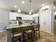 Modern kitchen featuring a large island with seating, stainless steel appliances, and ample cabinet space at 54 Woodsdale Se Pl, Concord, NC 28025