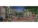 Charming street view with decorative lighting, trees, and inviting storefronts for a vibrant community at 54 Woodsdale Se Pl, Concord, NC 28025