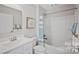 Bright bathroom featuring a shower-tub combination and a white single sink vanity at 571 Nesbe St # 2221, Lancaster, SC 29720