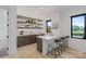 Stylish wet bar area with marble counters, floating shelves and scenic lake views at 5930 Midsomer Rd, Charlotte, NC 28214