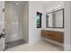 Contemporary bathroom featuring a glass walk-in shower, sleek vanity with a vessel sink, and a modern mirror at 5930 Midsomer Rd, Charlotte, NC 28214