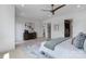 A spacious bedroom with a ceiling fan, a dresser, and an ensuite bathroom at 5930 Midsomer Rd, Charlotte, NC 28214