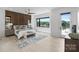 The main bedroom features a view, modern ceiling fan, and a wood accent wall at 5930 Midsomer Rd, Charlotte, NC 28214