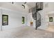 A large bonus room with carpet and a spiral staircase leading to an upper level at 5930 Midsomer Rd, Charlotte, NC 28214