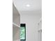Bright walk-in closet features custom white shelving, a small window, and modern design elements at 5930 Midsomer Rd, Charlotte, NC 28214
