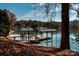 Picturesque waterfront featuring a private dock and peaceful lake views at 5930 Midsomer Rd, Charlotte, NC 28214