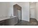 Modern kitchen featuring marble countertops, gray cabinetry, and stainless steel appliances at 5930 Midsomer Rd, Charlotte, NC 28214