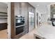 Modern kitchen features stainless steel appliances, custom cabinetry, and a sleek design at 5930 Midsomer Rd, Charlotte, NC 28214