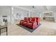 Spacious living room with a modern design featuring light wood floors, and red reclining sectional seating at 5930 Midsomer Rd, Charlotte, NC 28214