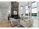 Bright and airy living room showcasing a modern fireplace, large windows, and comfortable seating at 5930 Midsomer Rd, Charlotte, NC 28214