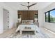 Inviting bedroom featuring wood accent wall and decorative rug at 5930 Midsomer Rd, Charlotte, NC 28214