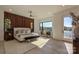 Serene main bedroom boasting hardwood floors, wood accent wall, and waterfront views at 5930 Midsomer Rd, Charlotte, NC 28214