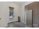 Well-equipped mud room with stainless steel fridge, marble floors, and outdoor access at 5930 Midsomer Rd, Charlotte, NC 28214