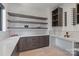 A butler's pantry with custom shelving, countertops, and wine storage at 5930 Midsomer Rd, Charlotte, NC 28214
