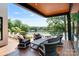 Waterfront patio with modern outdoor seating overlooks a beautiful lake view at 5930 Midsomer Rd, Charlotte, NC 28214