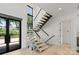 Modern staircase with glass panels and wood treads at 5930 Midsomer Rd, Charlotte, NC 28214
