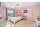 Pink bedroom features carpet and a ceiling fan at 6057 Erie View Ct, Denver, NC 28037