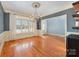 Dining room featuring hardwood floors, chandelier, and large windows with lots of light at 6057 Erie View Ct, Denver, NC 28037