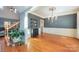 Dining room featuring hardwood floors, chandelier, and large windows with lots of light at 6057 Erie View Ct, Denver, NC 28037