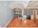 Open foyer featuring hardwood floors, skylight, staircase, and entrance to the living and dining rooms at 6057 Erie View Ct, Denver, NC 28037