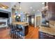 Open kitchen featuring stainless steel appliances, granite countertops, and a breakfast bar at 6057 Erie View Ct, Denver, NC 28037