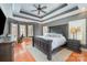 Main bedroom featuring a decorative ceiling, hardwood floors, and lots of natural light at 6057 Erie View Ct, Denver, NC 28037