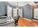 Bright office features hardwood floors, a desk, and natural light from the many windows at 6057 Erie View Ct, Denver, NC 28037