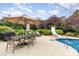 Outdoor dining and pool area with a slide and an umbrella-covered table and chairs at 6057 Erie View Ct, Denver, NC 28037