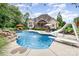Backyard oasis features a pool with diving board and slide at 6057 Erie View Ct, Denver, NC 28037