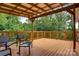 The large back deck offers plenty of space for outdoor gatherings and scenic views of the surrounding trees at 6294 Southlake Dr, Hickory, NC 28601