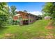 Expansive backyard featuring a multi-level deck perfect for outdoor entertaining, and green lawn at 6294 Southlake Dr, Hickory, NC 28601