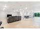 This finished basement area offers a comfortable living space with recessed lighting and walk-out access to the outdoors at 6294 Southlake Dr, Hickory, NC 28601