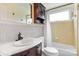 The bathroom features a wooden vanity, a round sink, and bright yellow walls, for a warm and traditional style at 6294 Southlake Dr, Hickory, NC 28601