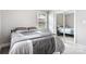 This is a cozy bedroom that features neutral walls, a closet with mirrored doors, and great natural lighting at 6294 Southlake Dr, Hickory, NC 28601