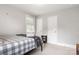 This light and bright bedroom provides an airy feel with neutral walls and natural lighting from the large windows at 6294 Southlake Dr, Hickory, NC 28601