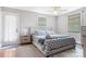 Bright bedroom with stylish bedding, gray accents, and natural light at 6294 Southlake Dr, Hickory, NC 28601