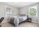 Well-lit bedroom with lake views, large windows, neutral tones, and cozy carpet at 6294 Southlake Dr, Hickory, NC 28601